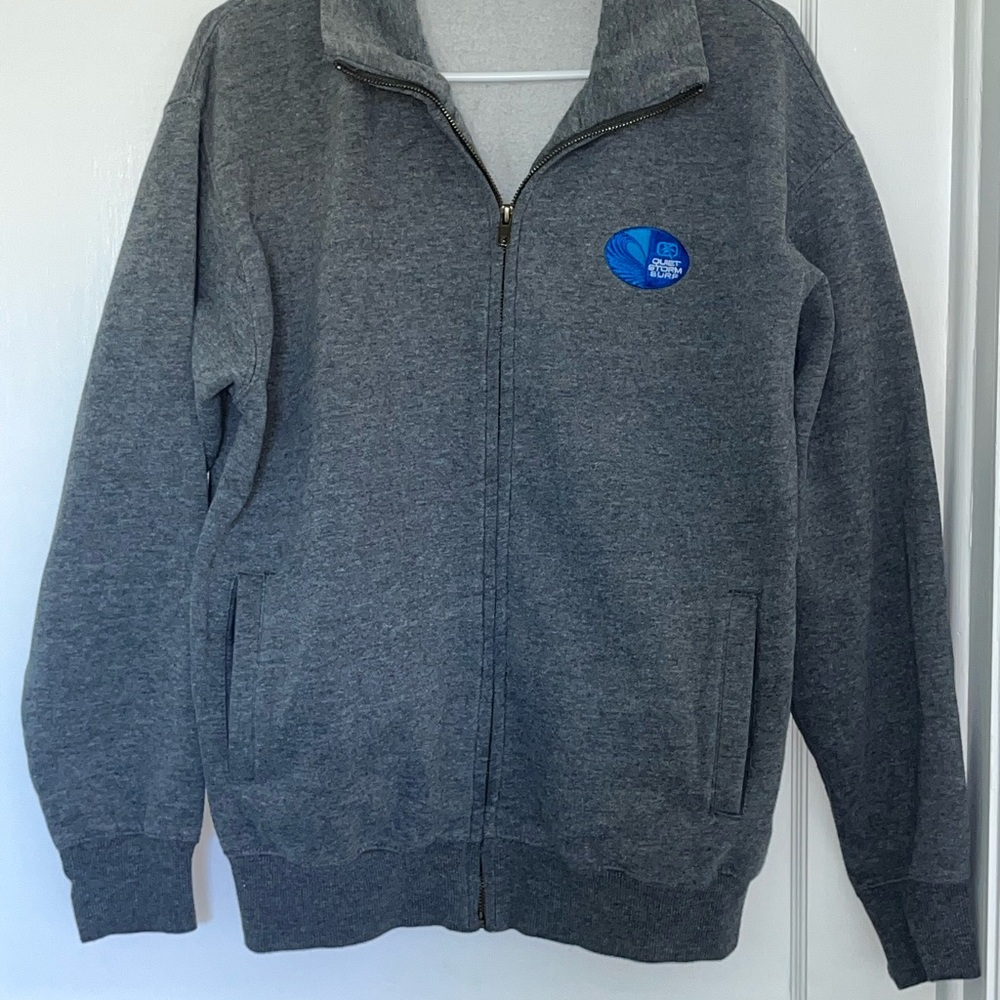 Gray Zip-Up Jacket with Quiet Storm logo left chest.